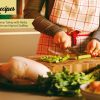 Young Woman Cooking in the kitchen with Healthy ingredients and turkey